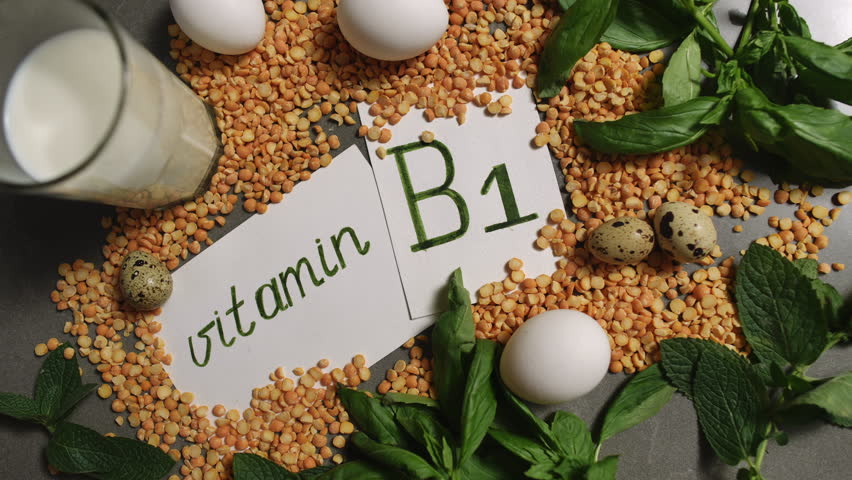 An artistic arrangement beautifully showcasing various Vitamin B1 rich foods such as lentils, eggs, and milk