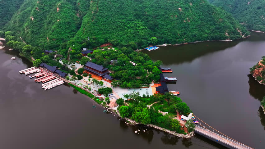 Aerial view orbiting the temple at the Huanghuacheng Great Wall, summer in China