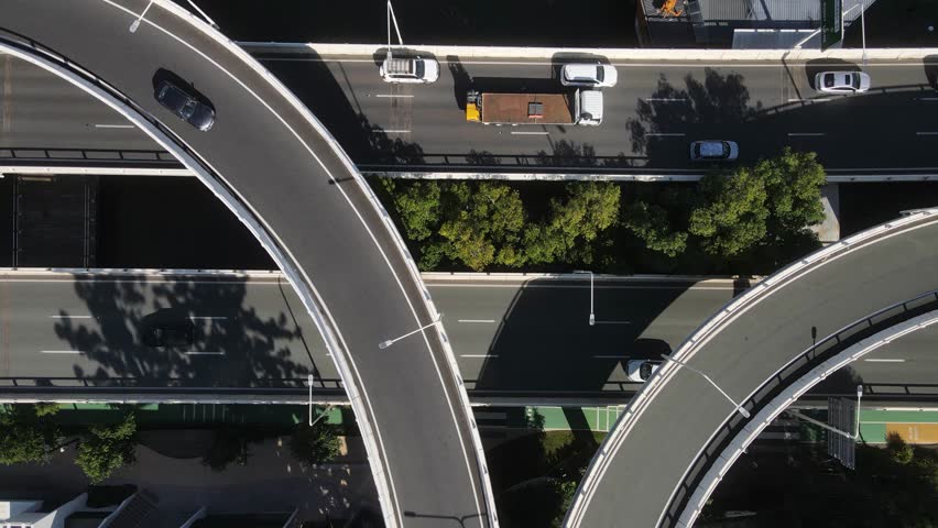 Network of overpasses and intertwining roads connecting the Central Business District along the Brisbane River. Aerial view