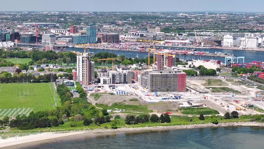 Construction of apartments in Dublin, housing crises Ireland. Aerial cityscape, sunny day.