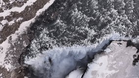 Drone view of icy Dettifoss waterfall in Iceland, frozen cliffs, raging water and scenic winter beauty. - Powered by Shutterstock - Get 15% off with code: PIKWIZARD15