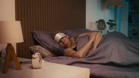 Middle-aged woman preparing for sleep at night, wearing eye mask, restful health - Powered by Shutterstock - Get 15% off with code: PIKWIZARD15