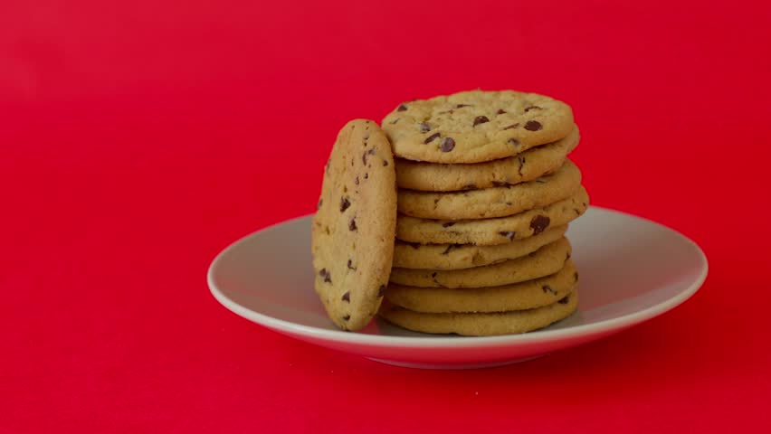 A plate of cookies is piled on top of each other
