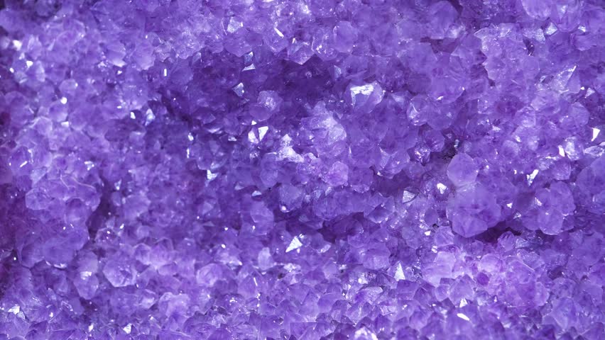 Amethyst - mineral of quartz group. Stones and minerals, riches of Earth. Natural amethyst crystal geode. Purple amethyst geode - small cavity in rock lined with crystals or other mineral matter