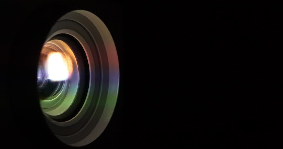 Movie is shown through projector, close-up shot video