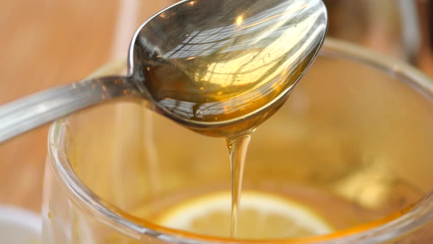 Honey drizzle into lemon tea
