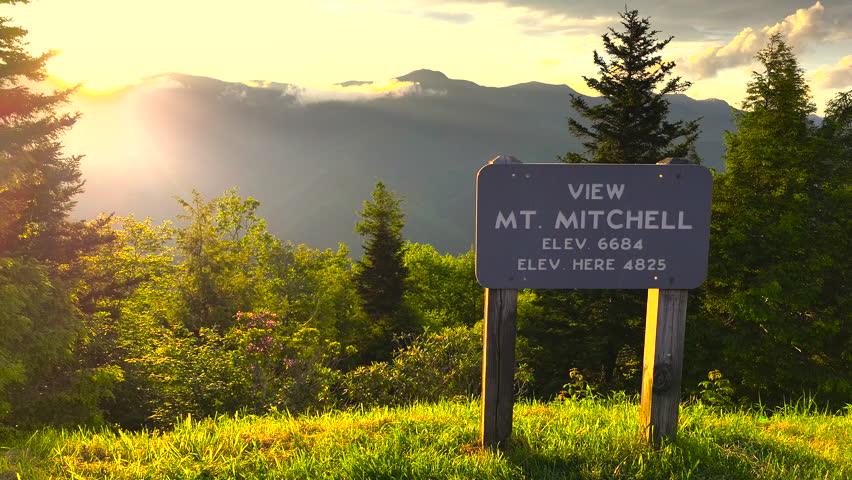 Car road trip on Blue Ridge Parkway in North Carolina Appalachian mountains. Mt Mitchell Overlook in summer season at sunset. Summertime landscape of beautiful nature
