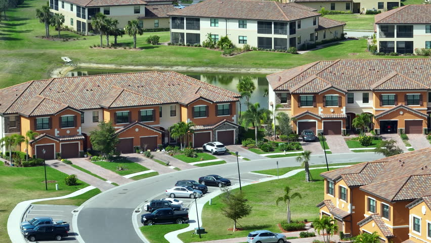 Suburban Florida residential complex with modern condominiums and landscaped surroundings, illustrating U.S. housing trends.