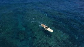 Surfer woman on surfboard ride on wave in ocean. Surf girl on longboard. Aerial view - Powered by Shutterstock - Get 15% off with code: PIKWIZARD15