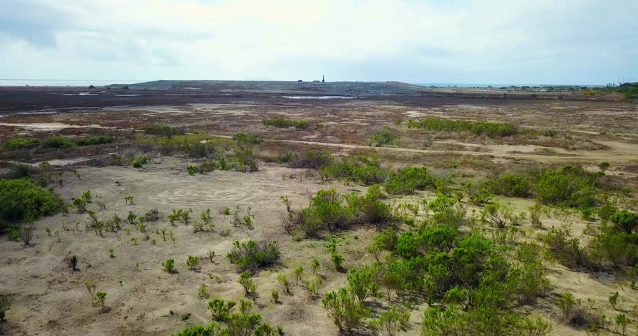 Aerial drone view of Halaco concrete mound overshadowing wetlands