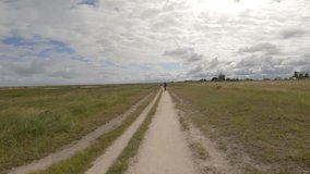 Theme is bicycle trip through north of France, region of Brittany and Normandy. POV view of cyclists on a gravel bike and walk path along the ocean in Saint-Malo. Cycling route in Mont Saint-Michel - Powered by Shutterstock - Get 15% off with code: PIKWIZARD15