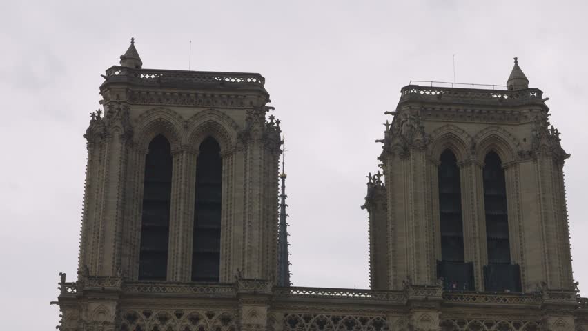 View on the medieval Catholic cathedral church Notre-Dame de Paris in French Gothic style at the Place Jean-Paul II on the island Ile de la Cite, 4th arrondissement of Paris, France.