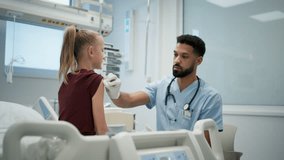Doctor giving vaccine to young girl during childhood immunization. - Powered by Shutterstock - Get 15% off with code: PIKWIZARD15