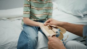 Close up of pediatric patient receiving orthopedic wrist brace after arm injury. - Powered by Shutterstock - Get 15% off with code: PIKWIZARD15
