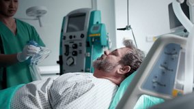 Doctor providing oxygen ventilation to unconscious patient in hospital. - Powered by Shutterstock - Get 15% off with code: PIKWIZARD15