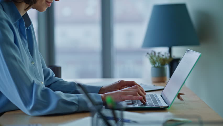 Entrepreneur planning e-commerce project typing laptop at company workplace closeup. Professional woman manager working computer thinking success. Beautiful businesswoman developing business startup.