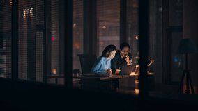 Business team frustrated bad news at laptop working overtime in dark office. Stressed colleagues worried project failure closing computer. Two upset managers feeling despair losing money late evening. - Powered by Shutterstock - Get 15% off with code: PIKWIZARD15