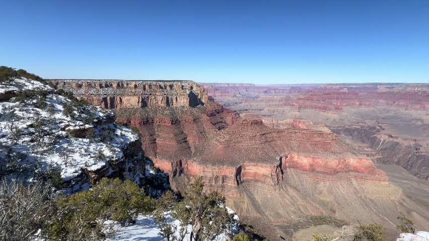 The snowcovered views of the Grand Canyon highlight its breathtaking winter beauty and enchanting landscape