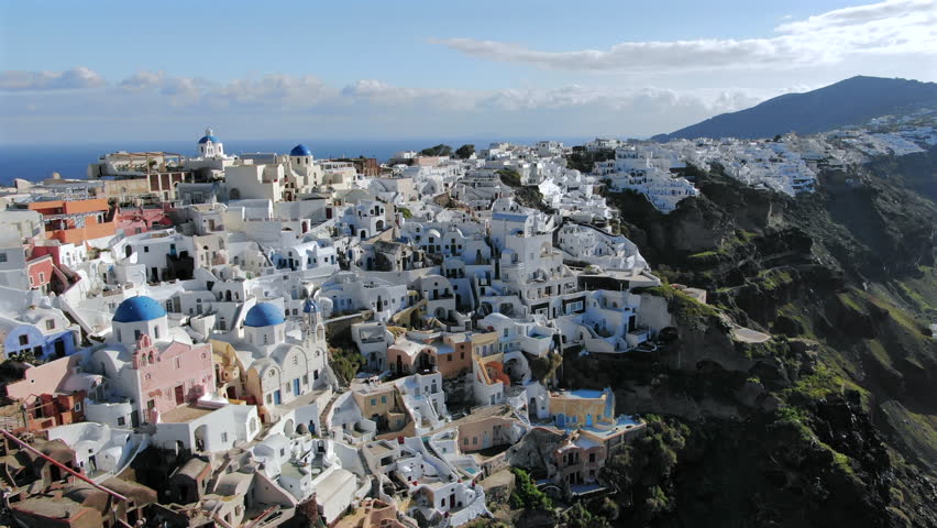 Discover and explore breathtaking aerial shots of Santorini island Greece, a premier tourist attraction in Greece, perfect for unforgettable vacations and idyllic holidays under the Mediterranean sun