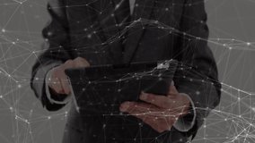 Businessman tapping and swiping tablet while initiating overlay brightening and aggregating data. Technology, data, innovation, digital, connectivity, analytics, virtual - Powered by Shutterstock - Get 15% off with code: PIKWIZARD15