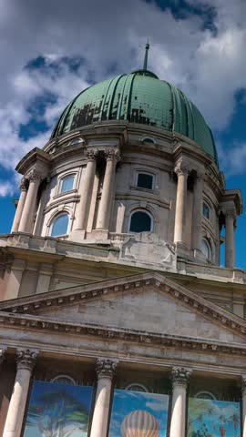 Budapest, Hungary - May 25, 2025: Budapest, Hungary - May 25, 2025: Equestrian statue of Prince Eugene with Buda Castle under picturesque skies. Timelapse, slide transition, vertical orientation.