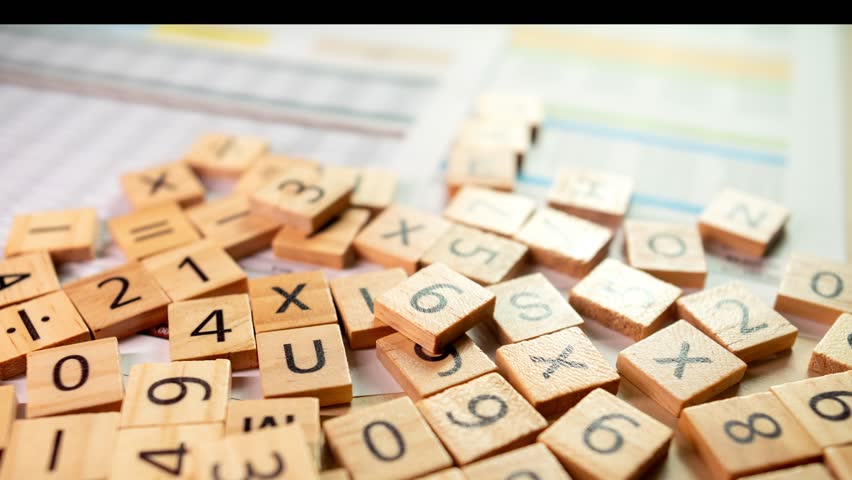 Explore the intricate arrangement of numbered tiles in a creative workspace capturing the essence of inspiration.