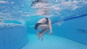 Girl Adorably Flipping And Playing Underwater In The Pool - Powered by Shutterstock - Get 15% off with code: PIKWIZARD15