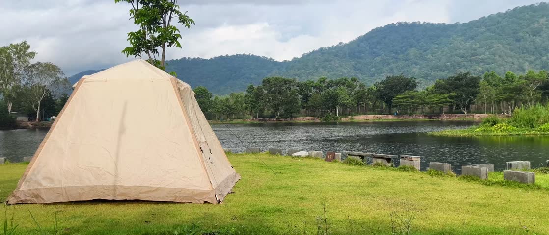 Camping Tent with Mountain View

Scenic video of a camping tent set up in front of a beautiful mountain landscape. Ideal for themes of outdoor adventure, travel, freedom, and nature exploration.