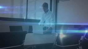 Executive typing on laptop in conference room spawning nodes filling room illustrating networking. Technology, connectivity, digital, innovation, business, communication, modern - Powered by Shutterstock - Get 15% off with code: PIKWIZARD15