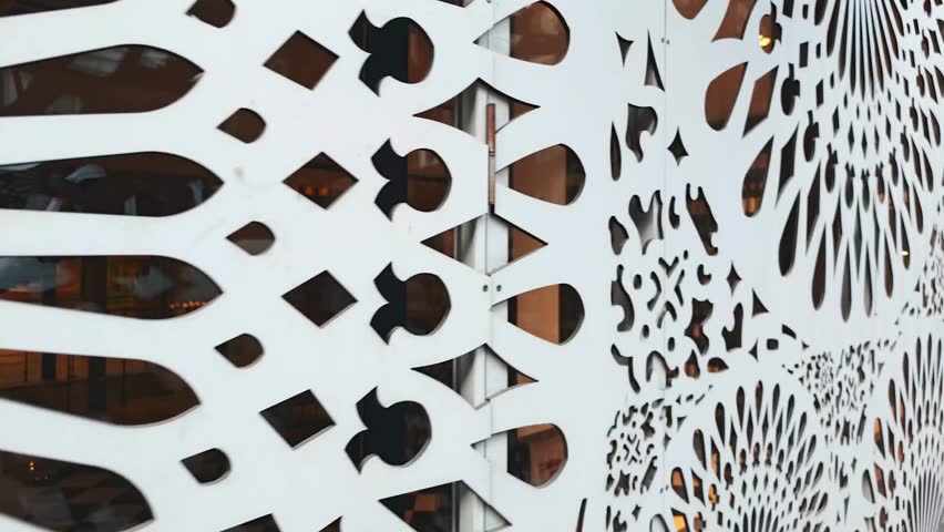 Decorative partition with oriental motifs lets light pass through