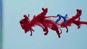 Red and blue ink or paint slowly diffusing and swirling in water against a light blue background. Gentle fluid motion, colorful abstract art, creative ink drop patterns, and serene liquid effects.
 - Powered by Shutterstock - Get 15% off with code: PIKWIZARD15
