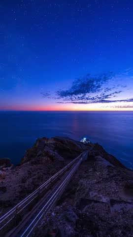 Red mountain path under stars.