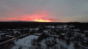 Winter Suburban Village at Dusk with Fiery Sunset and Snow-Covered Rooftops - Powered by Shutterstock - Get 15% off with code: PIKWIZARD15