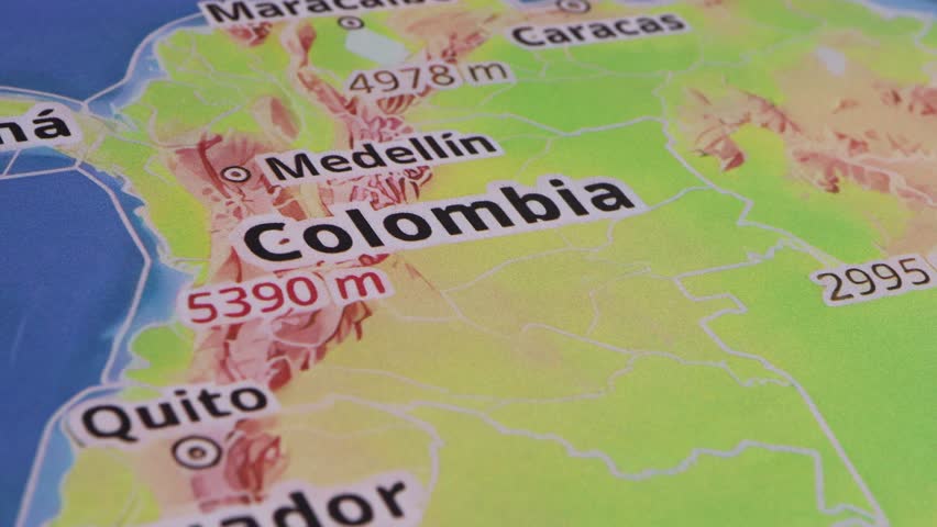 Close-up of a geographical map, specifically Colombia, as part of a travel destination.
