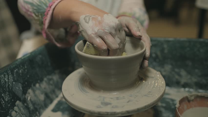 Professional hands in clay pottery in Pakistan. Arts.