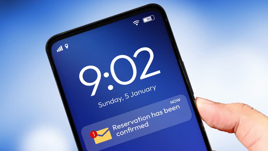 The reservation confirmed notification appears on the smartphone screen, 4k footage. Close up, booking, hotel, reserve.