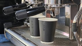 Barista making two takeaway coffees using a professional espresso machine - Powered by Shutterstock - Get 15% off with code: PIKWIZARD15