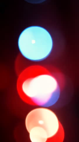 Abstract background with flashing red and blue lights. Vertical video.