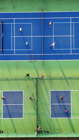 Aerial View on top Drone Shot of Active Pickleball Game on Courts, outdoor pickleball courts with players actively engaged