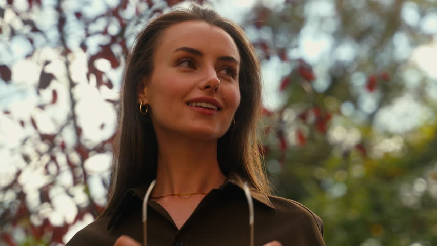 Attractive girl model woman put on sunglasses in street. Portrait stylish female in trendy glasses outdoors in sunny day fashion concept confident businesswoman business lady smiling in city headshot
