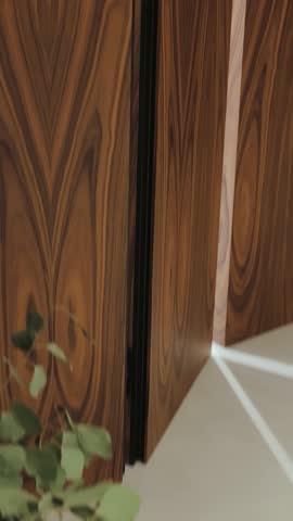 Elegant design of wooden cabinet doors with graceful lines. Wood texture. Luxury Modern Interior. Vertical video