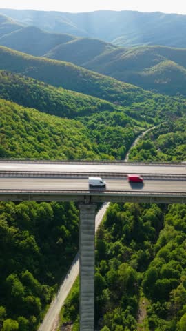 Cargo Trailer Truck on Mountain Highway Logistic Services and International Freight Vertical