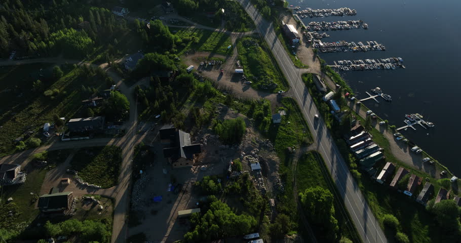 Tilting drone shot of Shadow Mountain Lake at sunrise in the Rocky Mountains of Colorado