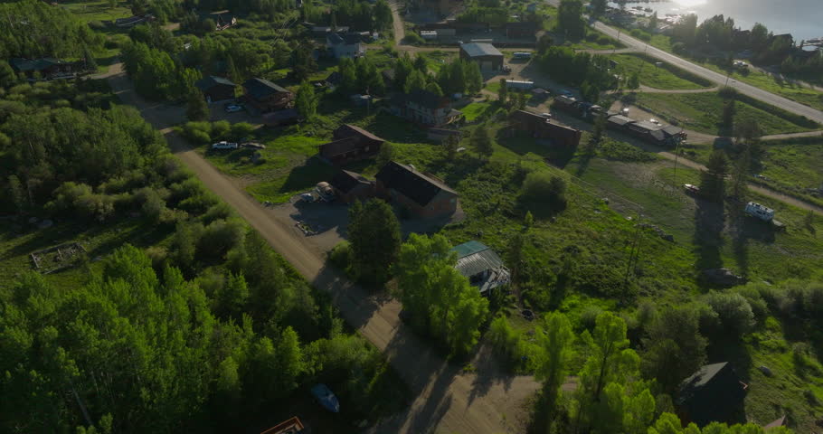 Tilting drone shot of Shadow Mountain Lake at sunset in the Rocky Mountains of Colorado