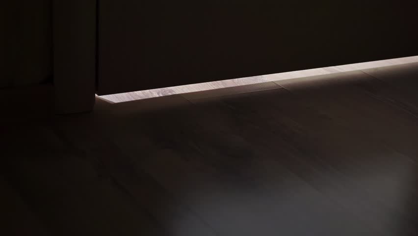 Light coming through doorway. Door opens from a dark hallway into a lighted room