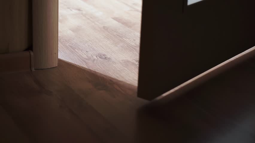 Light coming through doorway. Door opens from a dark hallway into a lighted room