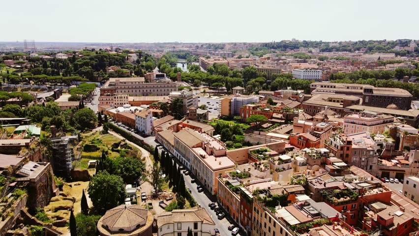 Dense cityscape of Rome highlights pollution, traffic, fading historical gems