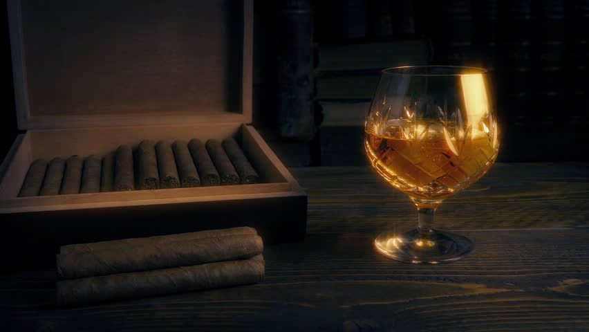 Cigar Box And Glass Of Whiskey Moving Shot