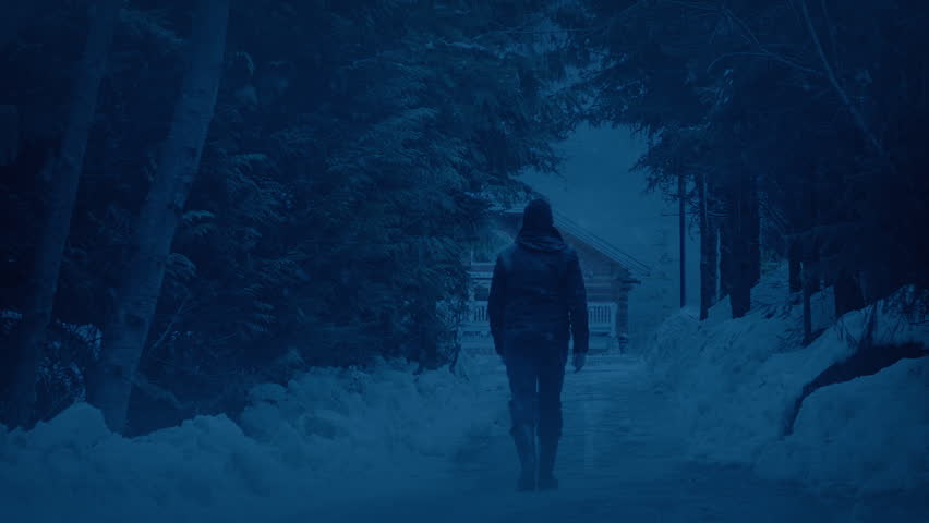 Man Walks To House On Snowy Evening