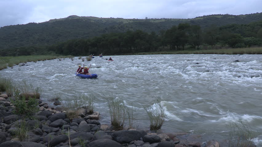 Groups of people whitewater rafting  in the Umkomaas river in Kwazulu Natal  